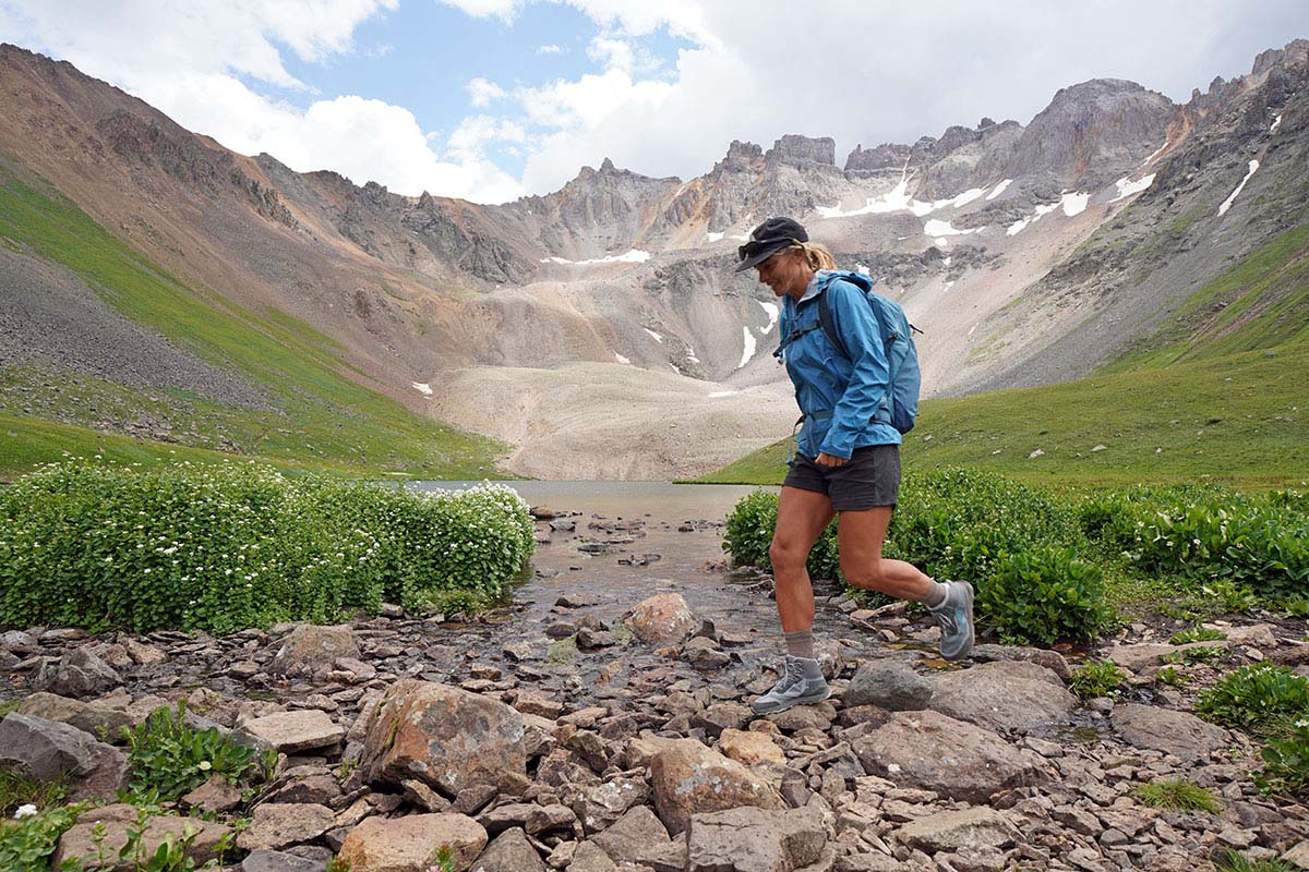 Women's hiking shoes (Altra Lone Peak ALL-WTHR Mid crossing rocky stream bed)